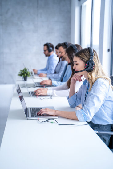 Customer support agent woman listening to client's inquiries, demonstrating her dedication providing top-notch service